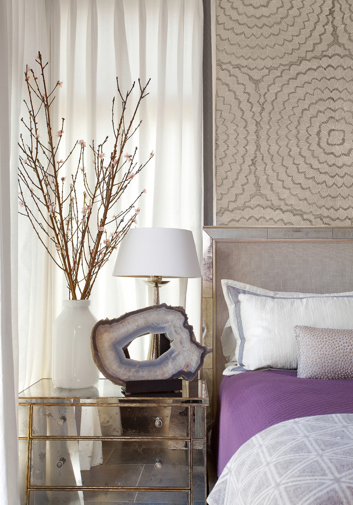 Inspiration for a large transitional guest bedroom in Austin with beige walls and carpet.