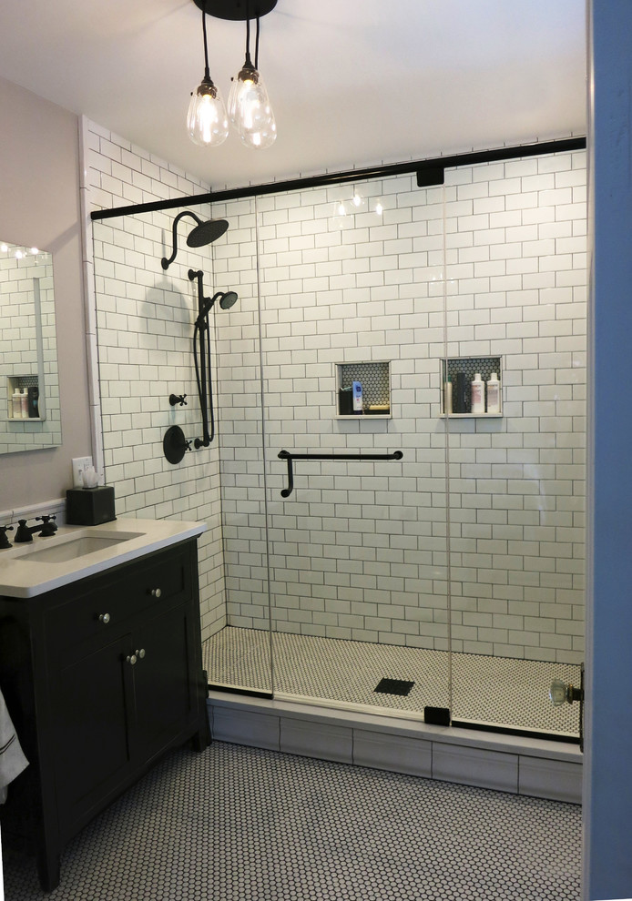 Mid-sized modern master bathroom in Boston with flat-panel cabinets, distressed cabinets, a two-piece toilet, white tile, porcelain tile, grey walls, porcelain floors, an undermount sink, engineered quartz benchtops, an alcove shower, white floor and a hinged shower door.