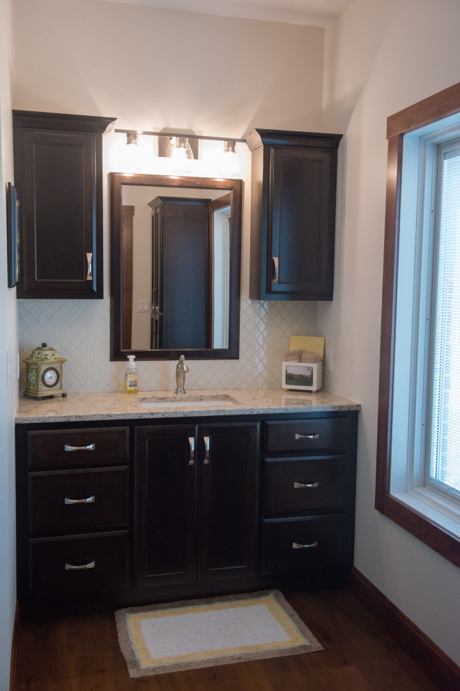 Photo of a mid-sized transitional master bathroom in Other with flat-panel cabinets, dark wood cabinets, white tile, porcelain tile, medium hardwood floors, an undermount sink, engineered quartz benchtops, multi-coloured benchtops, a single vanity and a built-in vanity.