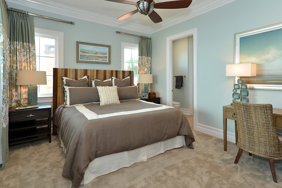Small beach style master bedroom in Tampa with blue walls, carpet, no fireplace and beige floor.