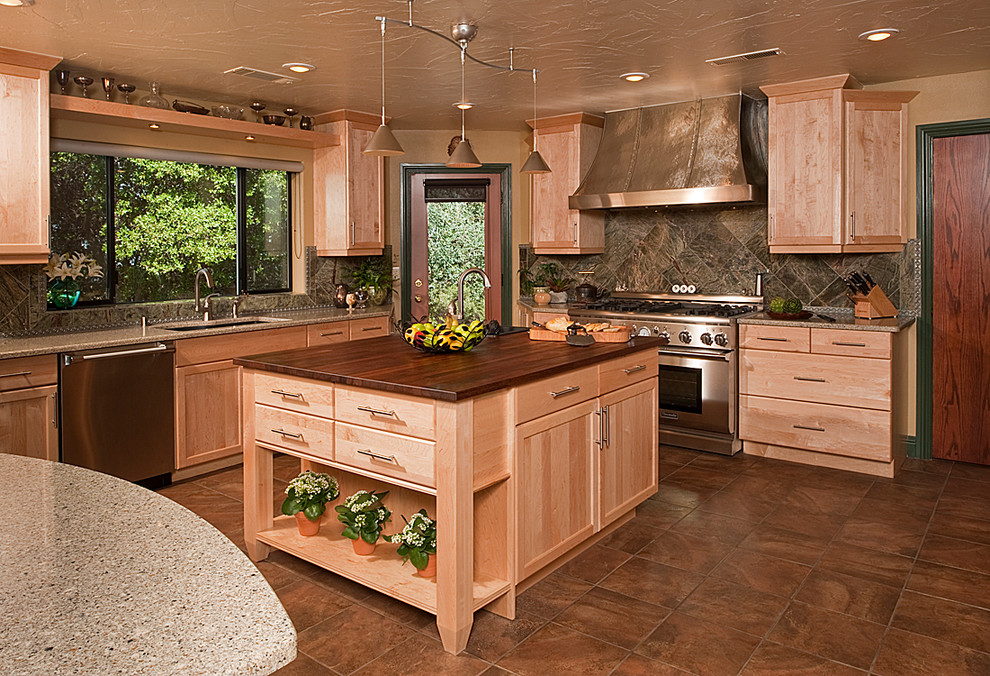 Open concept kitchen - large transitional u-shaped porcelain tile open concept kitchen idea with an undermount sink, recessed-panel cabinets, light wood cabinets, quartz countertops, green backsplash, stone tile backsplash, stainless steel appliances and beige walls