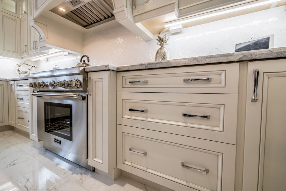 Example of a transitional kitchen design in Toronto