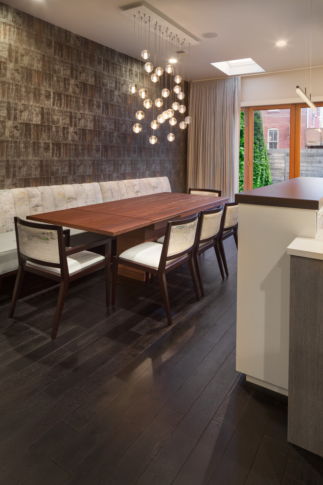 This is an example of a contemporary kitchen/dining combo in DC Metro with brown walls, dark hardwood floors and brown floor.