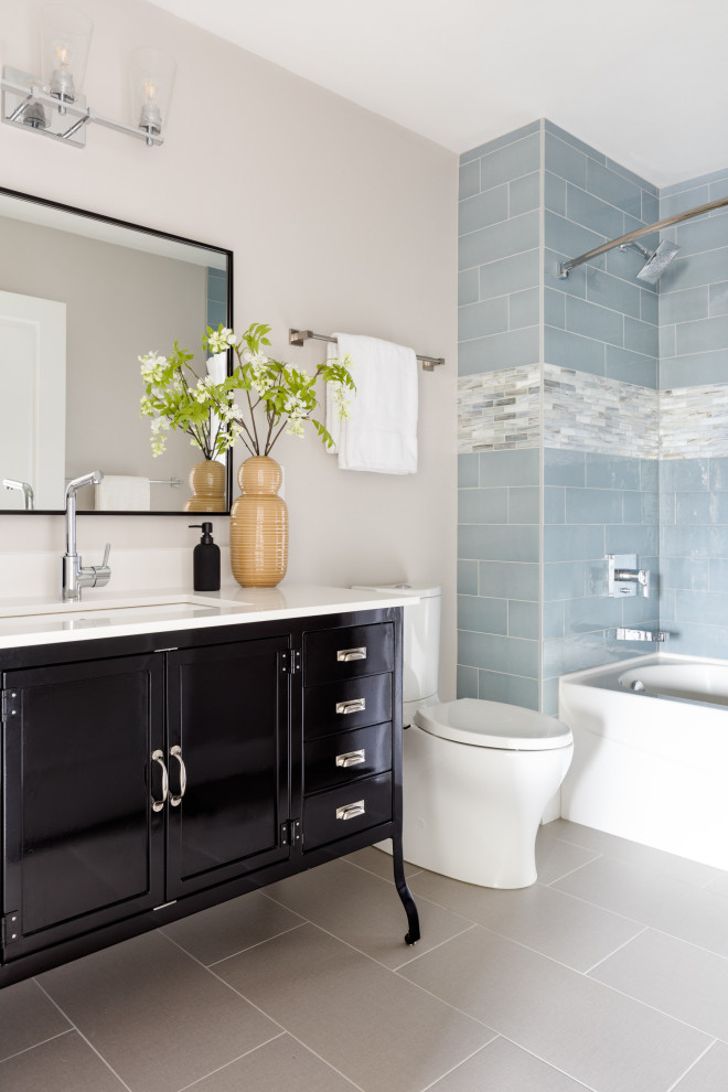 Photo of a mid-sized transitional kids bathroom in Seattle with black cabinets, a one-piece toilet, white tile, white walls, ceramic floors, engineered quartz benchtops, black floor, white benchtops, a single vanity, a freestanding vanity and shaker cabinets.