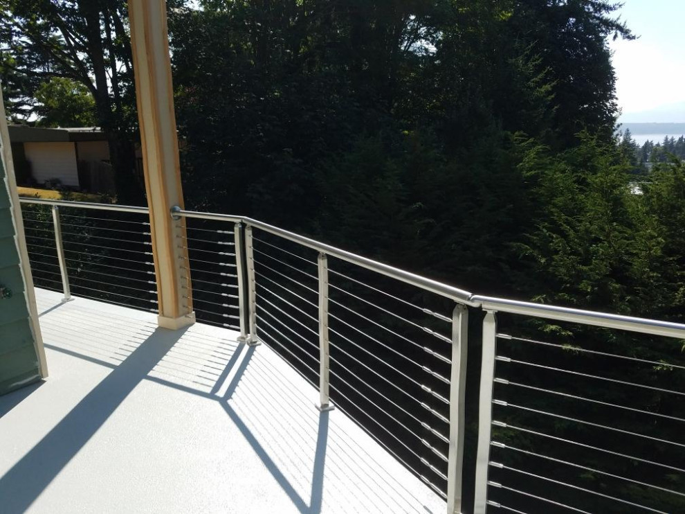Deck - large modern backyard deck idea in Seattle with no cover