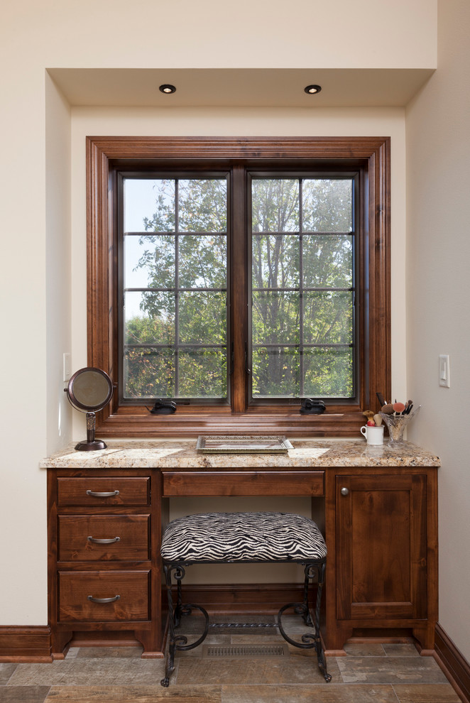 Mid-sized traditional master bathroom in Milwaukee with flat-panel cabinets, medium wood cabinets, brown tile, ceramic tile, beige walls, ceramic floors and granite benchtops.