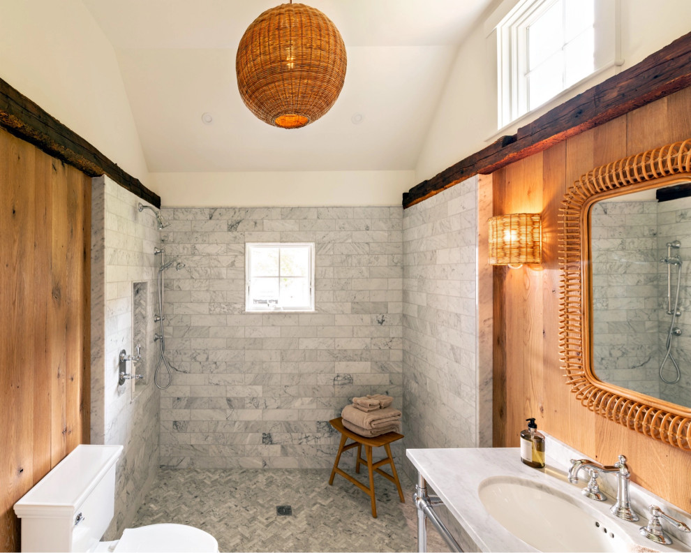 This is an example of a country bathroom in Boston with a curbless shower, an open shower and wood walls.