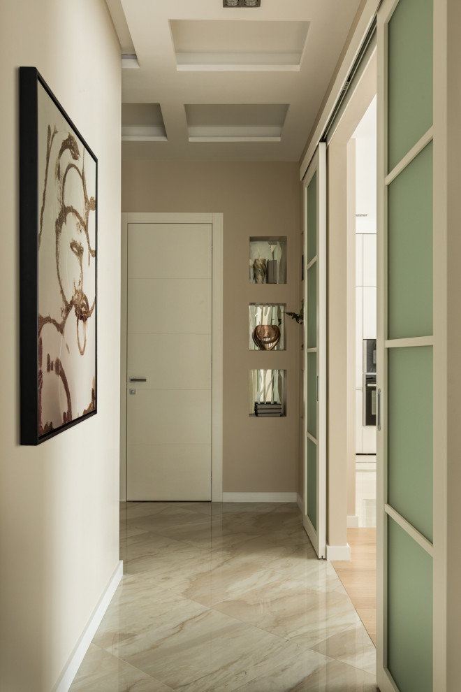 Design ideas for a mid-sized contemporary hallway in Moscow with beige walls, beige floor, recessed and porcelain floors.