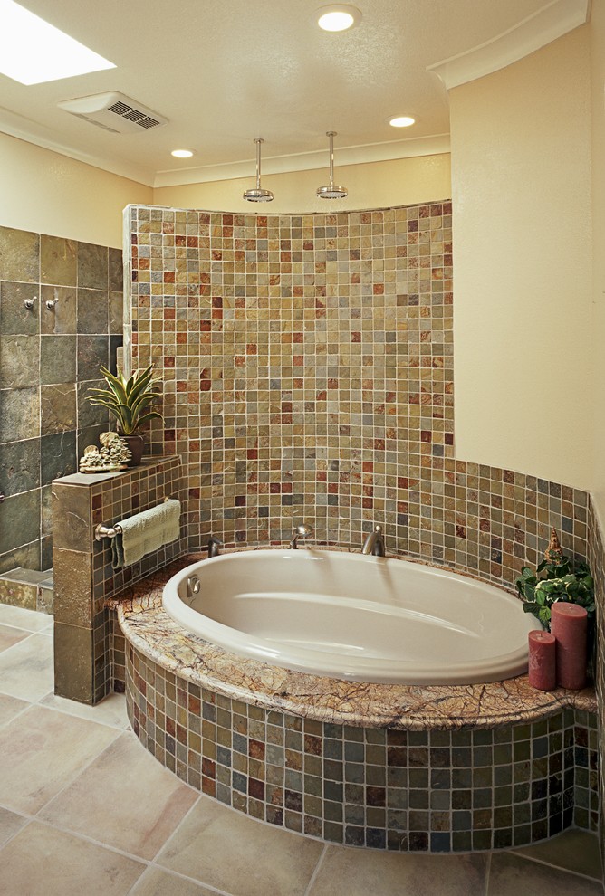 Design ideas for a large traditional master bathroom in Albuquerque with shaker cabinets, medium wood cabinets, granite benchtops, a drop-in tub, an alcove shower, beige tile, brown tile, gray tile, multi-coloured tile, orange tile, ceramic tile, beige walls, ceramic floors, beige floor and an open shower.