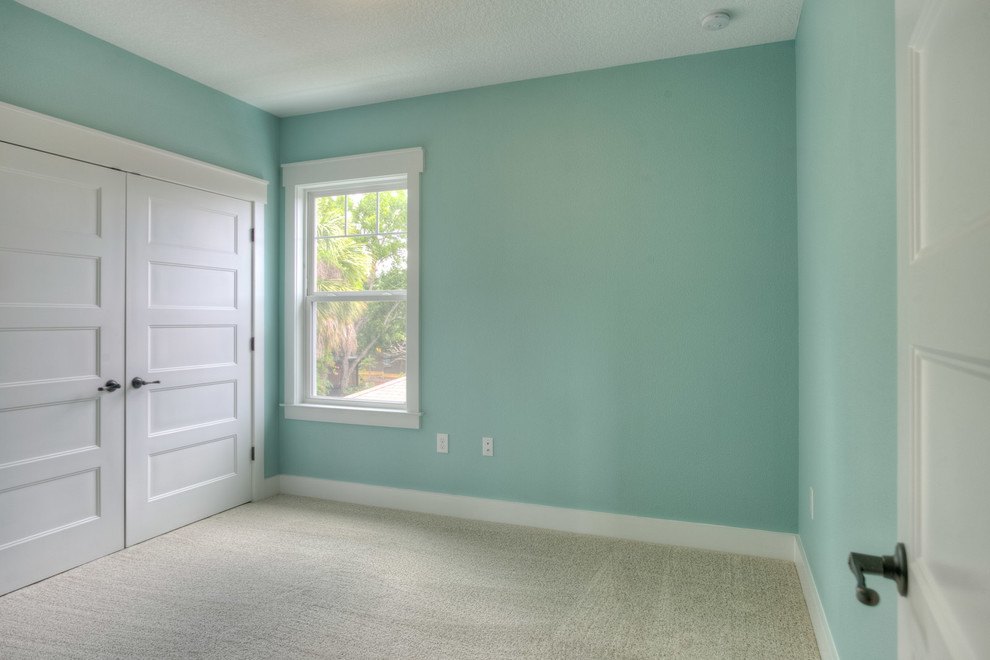 Photo of a beach style bedroom in Tampa.