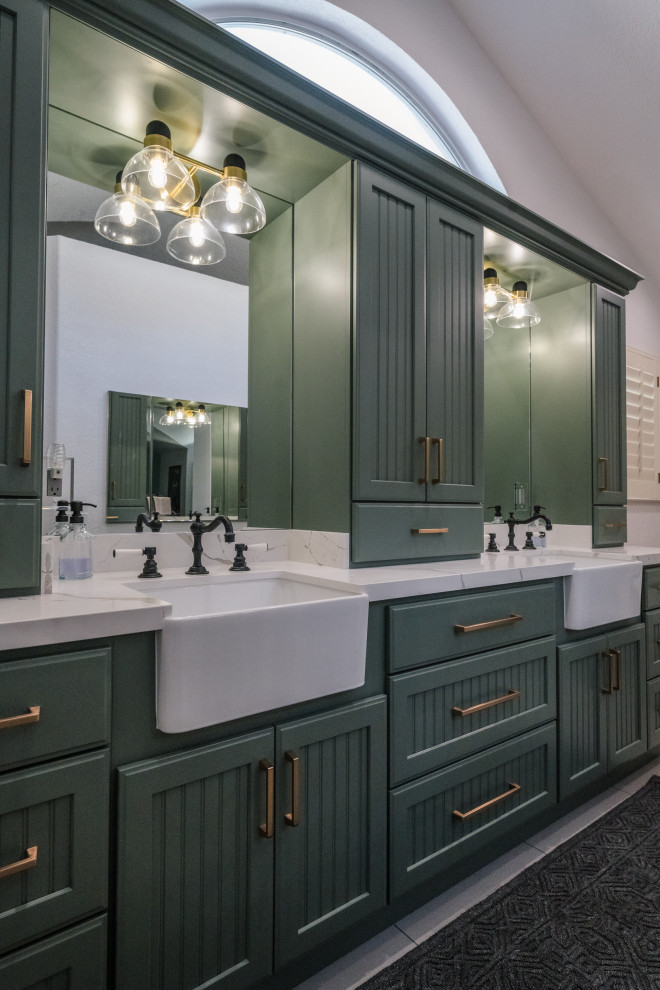 Large farmhouse master double-sink, porcelain tile, white floor and vaulted ceiling freestanding bathtub photo in San Francisco with recessed-panel cabinets, green cabinets, an undermount sink, quartz countertops, a hinged shower door, white countertops, a built-in vanity and white walls