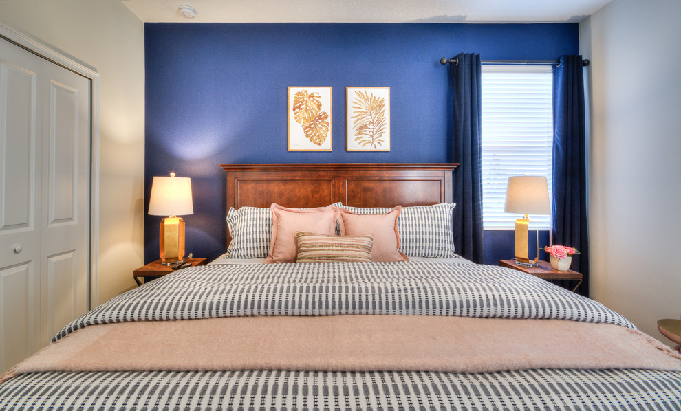 This is an example of a mid-sized traditional master bedroom in Orlando with white walls.