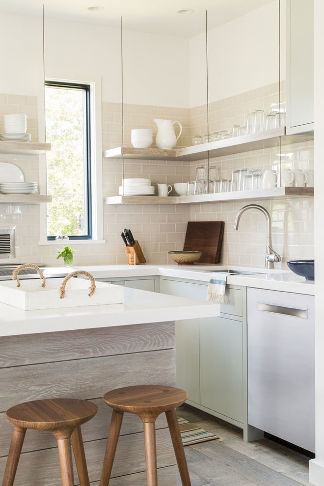 Inspiration for a beach style kitchen in Providence with an undermount sink, open cabinets, beige splashback, subway tile splashback, light hardwood floors and with island.
