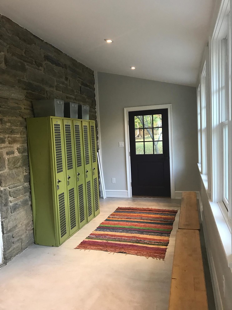 Mid-sized transitional mudroom in Philadelphia with grey walls and a single front door.