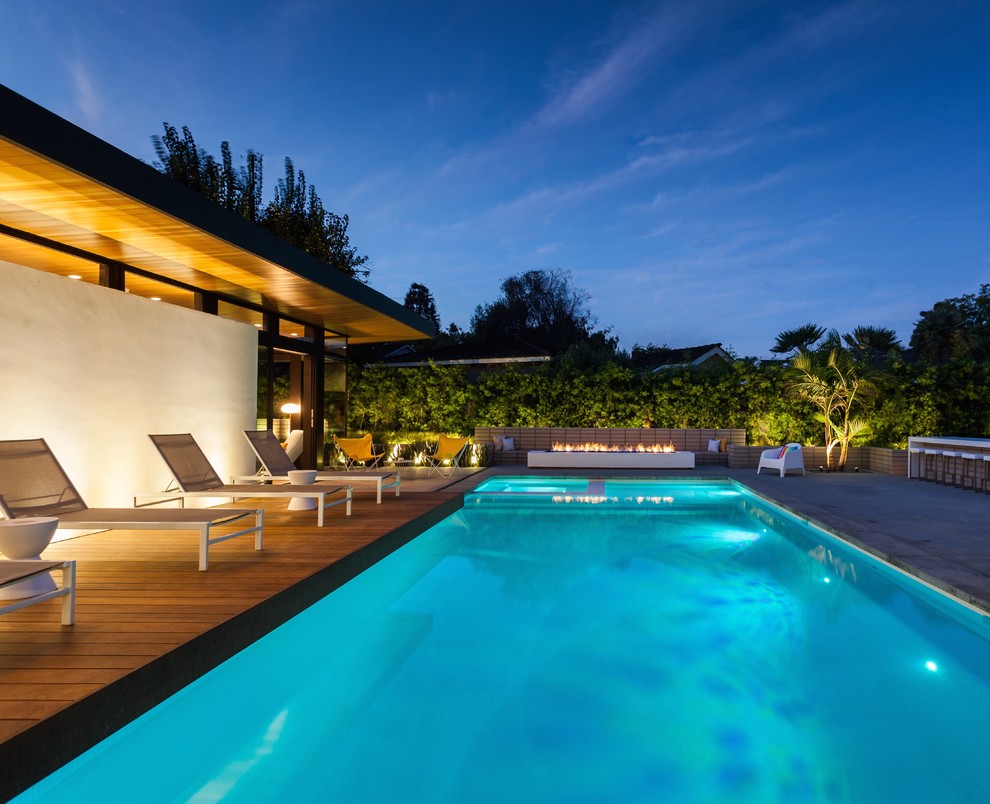 Inspiration for a contemporary rectangular pool in Los Angeles with decking.