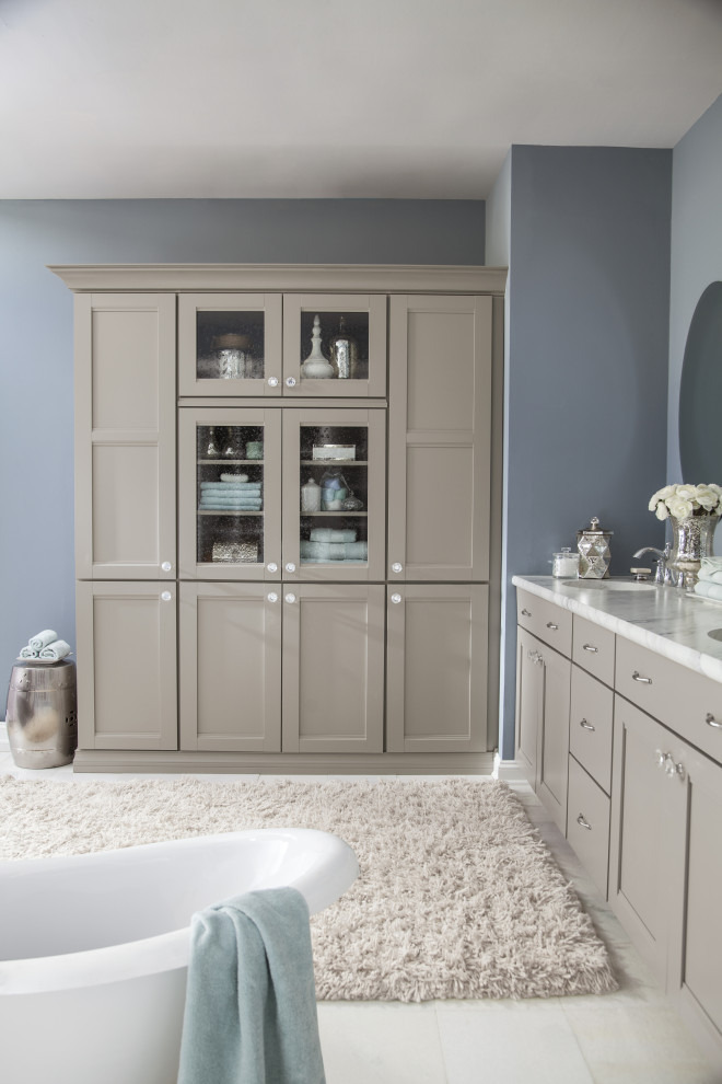 Freestanding bathtub - mid-sized transitional master blue tile porcelain tile, white floor and double-sink freestanding bathtub idea with shaker cabinets, gray cabinets, a one-piece toilet, blue walls, a drop-in sink, quartz countertops, a hinged shower door, white countertops and a built-in vanity