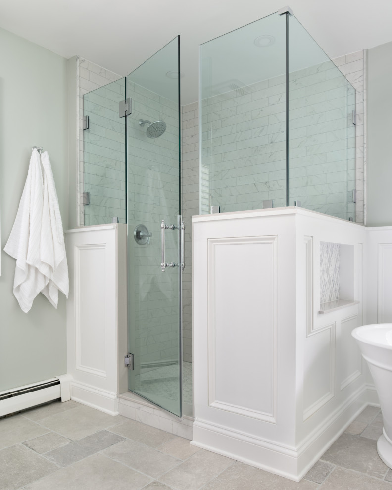 This is an example of a large traditional master bathroom in Baltimore with recessed-panel cabinets, grey cabinets, a freestanding tub, a corner shower, a two-piece toilet, gray tile, ceramic tile, green walls, ceramic floors, an undermount sink, engineered quartz benchtops, grey floor, a hinged shower door, white benchtops, a niche, a double vanity, a freestanding vanity and decorative wall panelling.