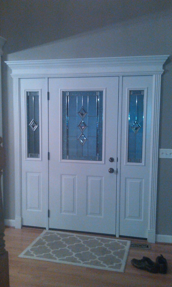 Entry door with White Door Interior & Crown Molding