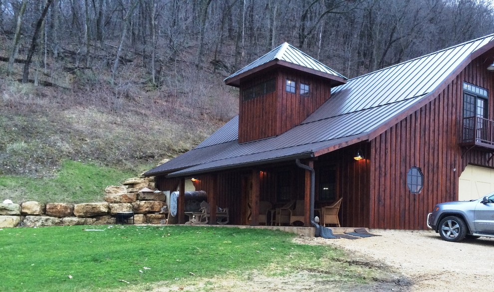 Mid-sized rustic brown two-story wood gable roof idea with a metal roof