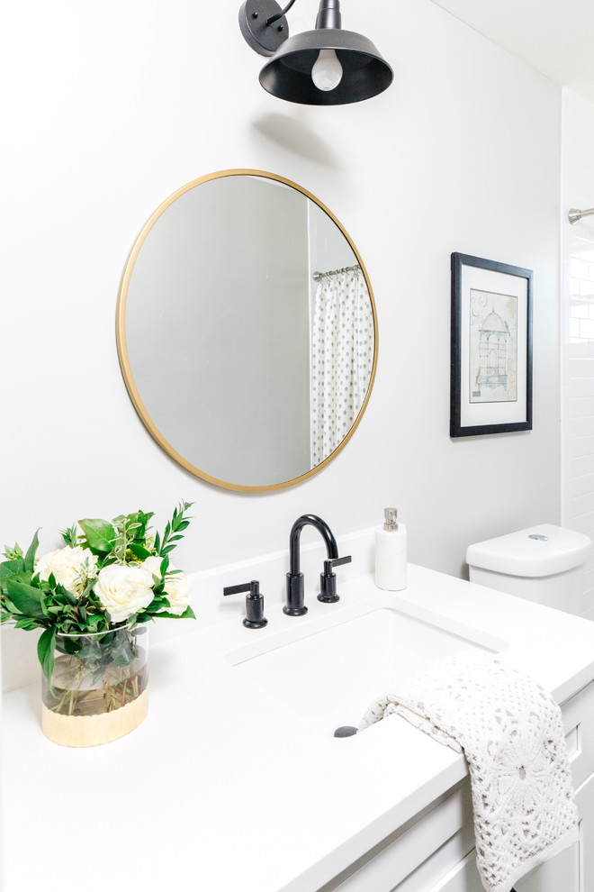 Transitional 3/4 white tile and subway tile slate floor and black floor alcove shower photo in Phoenix with shaker cabinets, white cabinets, white walls and an undermount sink