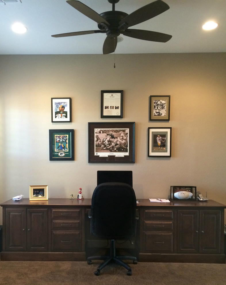 Mid-sized transitional home office in Phoenix with beige walls, carpet and a built-in desk.