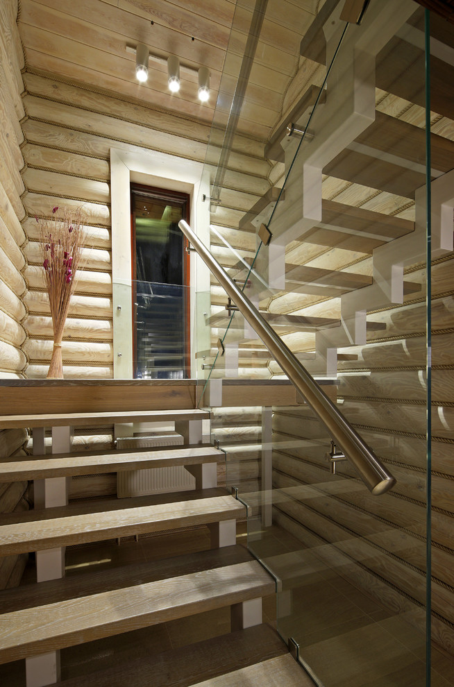 Photo of a contemporary wood u-shaped staircase in Moscow with open risers.