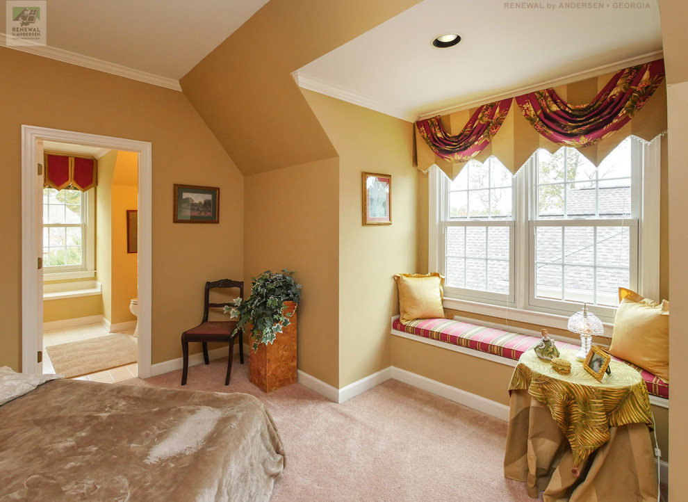 Mid-sized guest bedroom in Atlanta with yellow walls, carpet, no fireplace and pink floor.