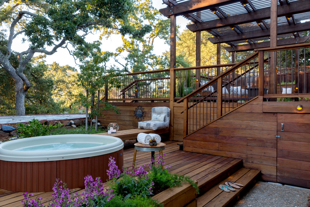 Inspiration for a large traditional backyard deck in San Francisco with a container garden, a pergola and mixed railing.