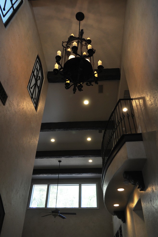 Design ideas for a large mediterranean foyer in Orlando with beige walls.