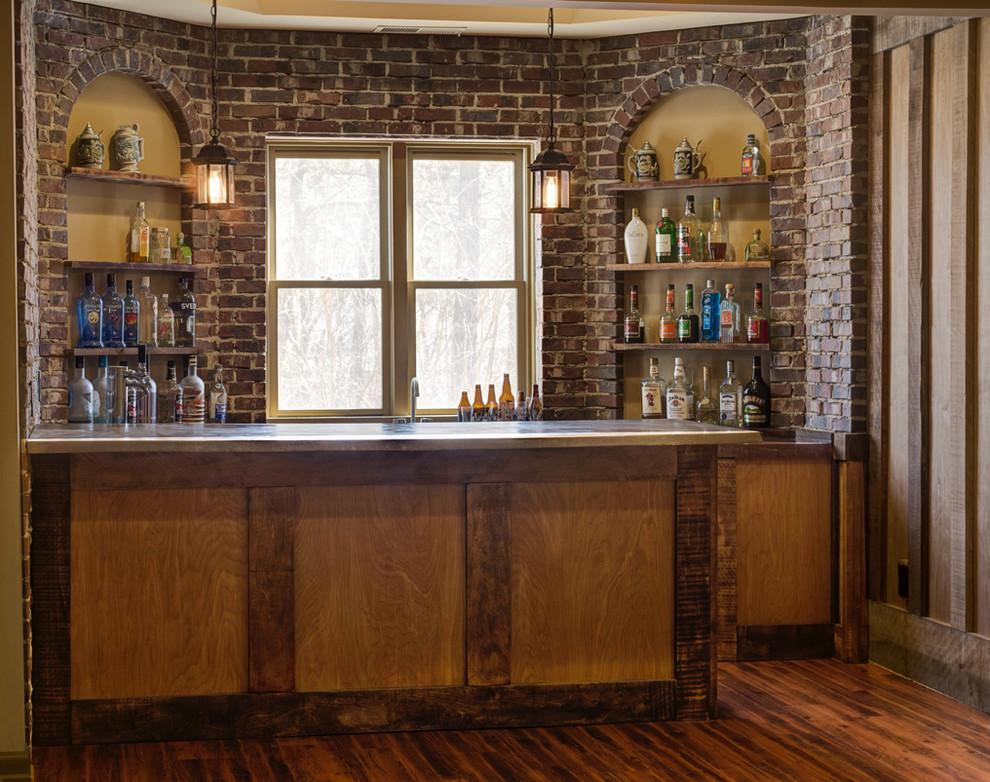 Photo of a mid-sized arts and crafts galley seated home bar in Atlanta with medium wood cabinets and medium hardwood floors.