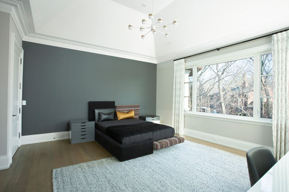 Inspiration for a guest medium tone wood floor and brown floor bedroom remodel in Toronto with gray walls