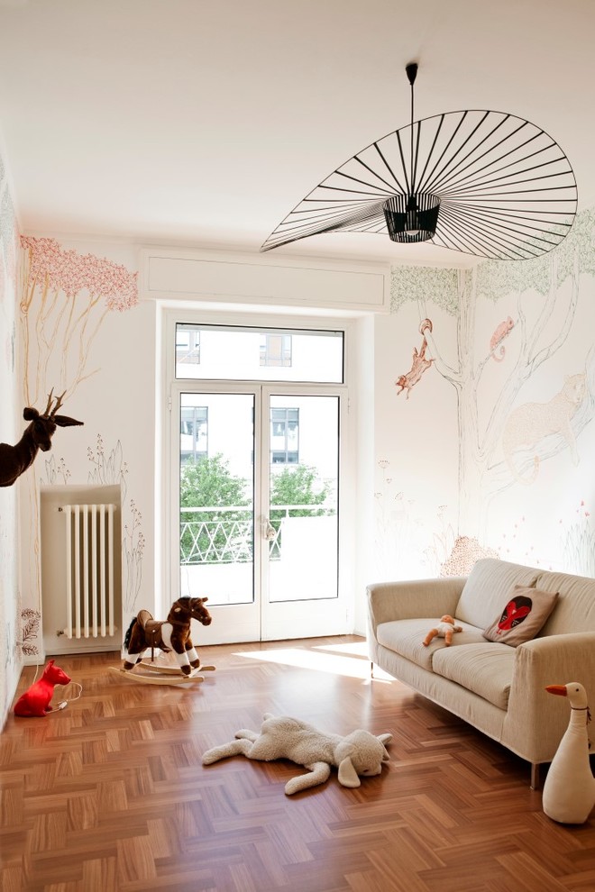 Mid-sized eclectic kids' bedroom in Milan with medium hardwood floors for kids 4-10 years old and girls.