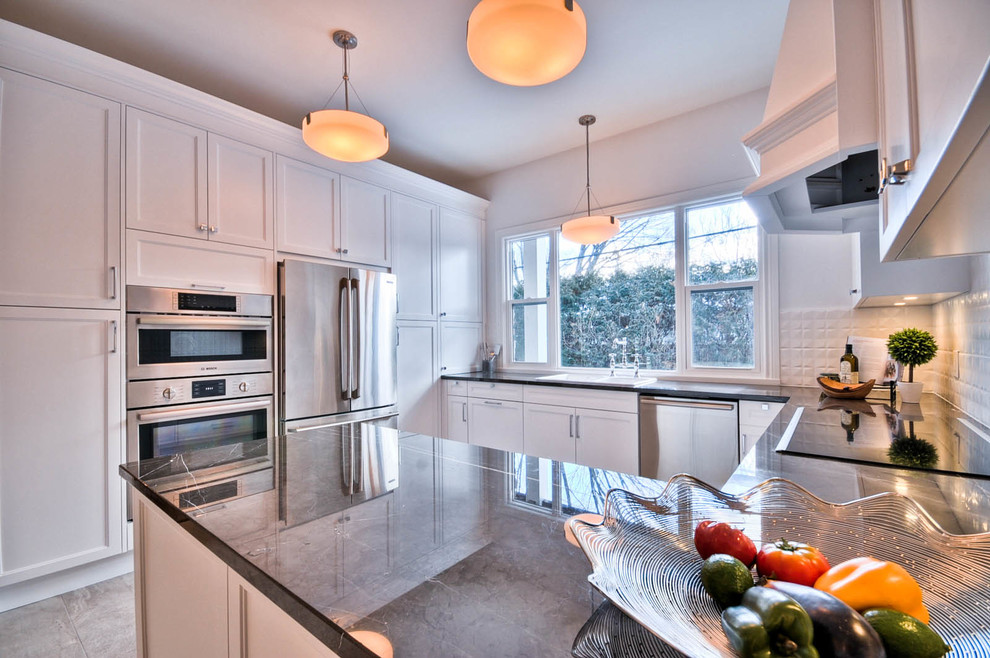 Inspiration for a mid-sized transitional u-shaped porcelain tile enclosed kitchen remodel in Ottawa with a drop-in sink, shaker cabinets, white cabinets, marble countertops, white backsplash, porcelain backsplash, stainless steel appliances and no island