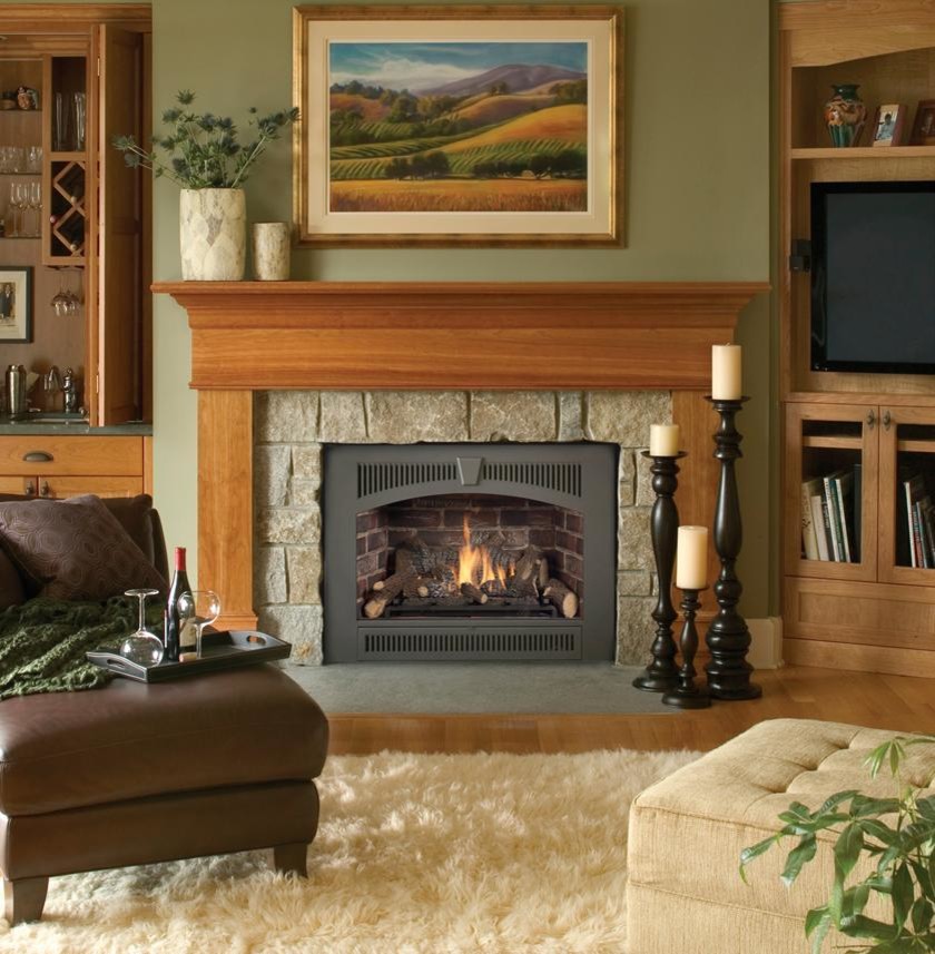 Design ideas for a mid-sized traditional bedroom in Other with beige walls, medium hardwood floors, a standard fireplace, a stone fireplace surround and brown floor.