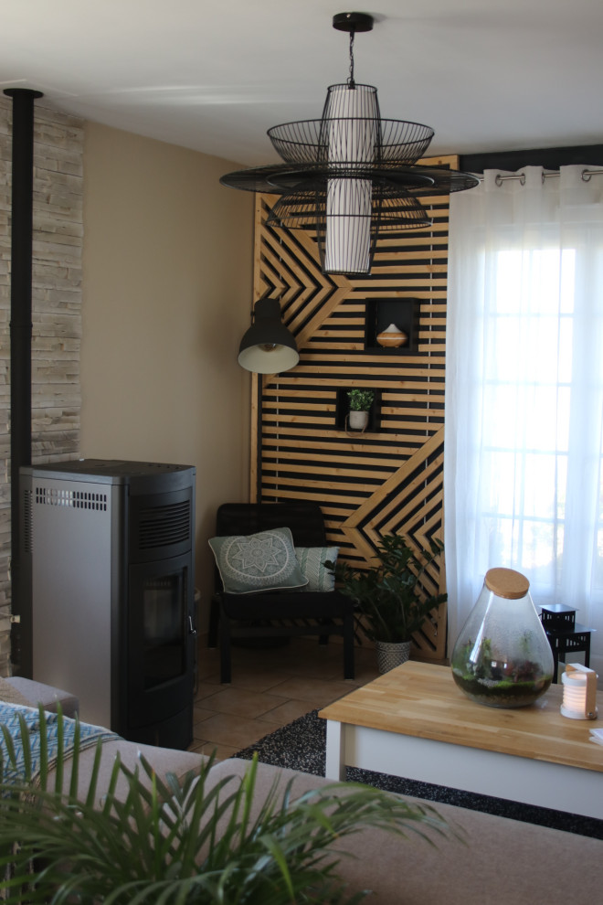 Huge urban u-shaped open concept kitchen photo with an undermount sink, light wood cabinets, black backsplash, slate backsplash, paneled appliances, an island and black countertops