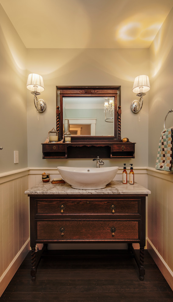 Design ideas for a mid-sized arts and crafts 3/4 bathroom in Vancouver with a vessel sink, furniture-like cabinets, dark wood cabinets, marble benchtops, a claw-foot tub, a shower/bathtub combo, a two-piece toilet, white tile, ceramic tile, blue walls and dark hardwood floors.