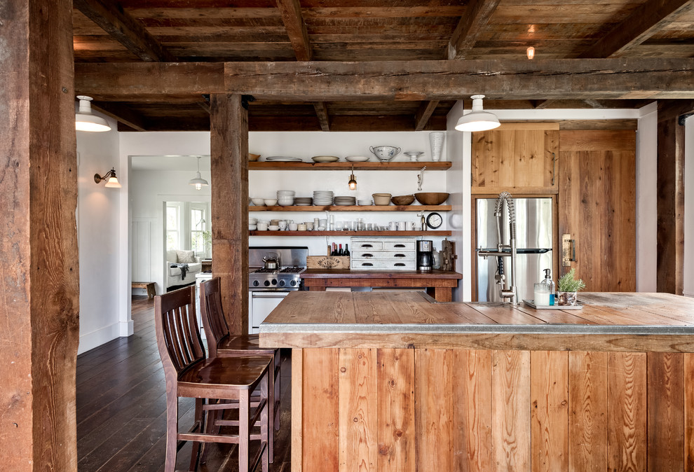 Design ideas for a country galley eat-in kitchen in San Francisco with a farmhouse sink, flat-panel cabinets, medium wood cabinets, wood benchtops, white splashback, stainless steel appliances, dark hardwood floors, with island, brown floor and brown benchtop.