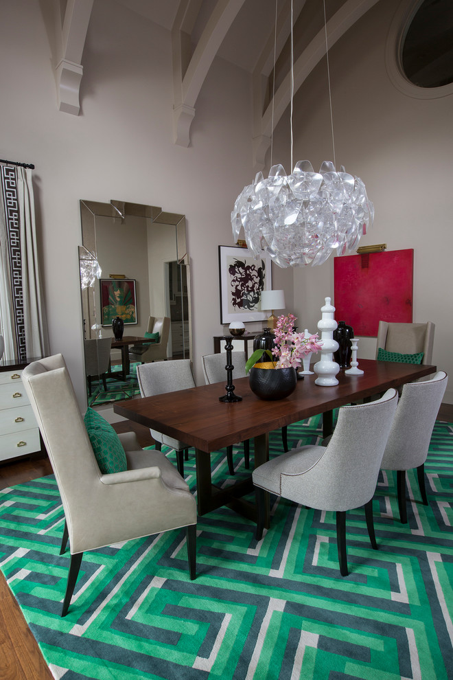 Photo of a large transitional separate dining room in Other with grey walls and medium hardwood floors.
