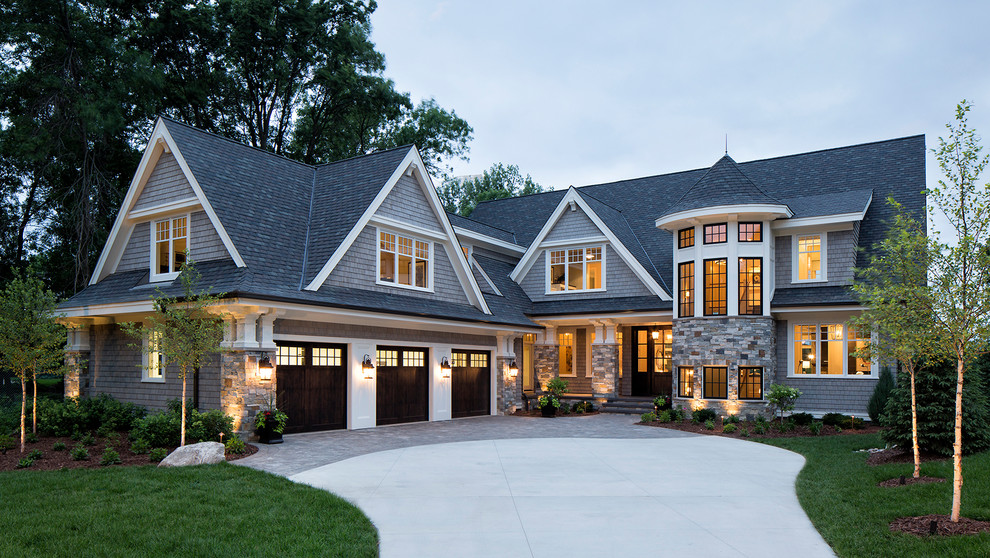 Design ideas for a traditional two-storey grey exterior in Minneapolis with wood siding.