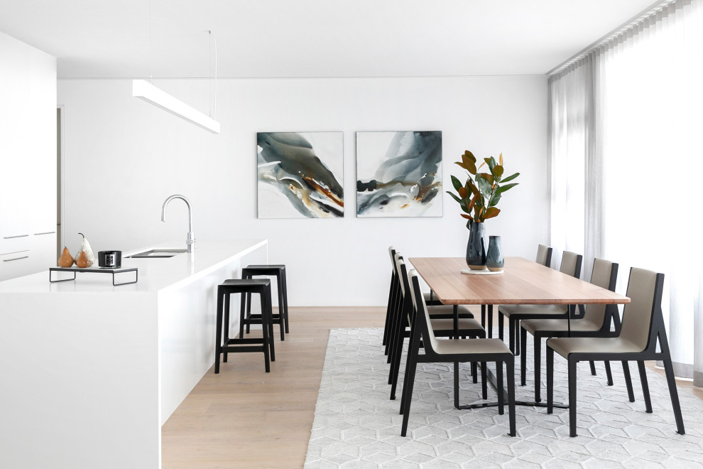 Inspiration for a large contemporary kitchen/dining combo in Sydney with white walls and beige floor.