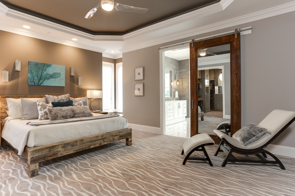 Design ideas for a transitional bedroom in Raleigh.