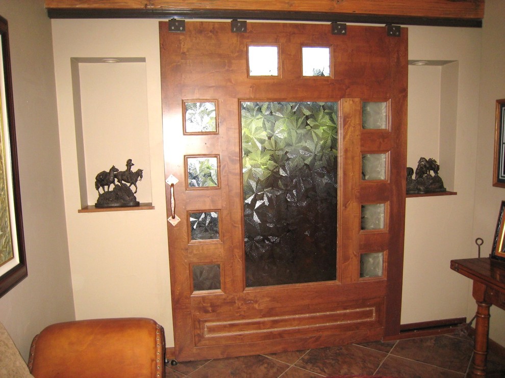 This is an example of a large country hallway in Sacramento with beige walls and porcelain floors.