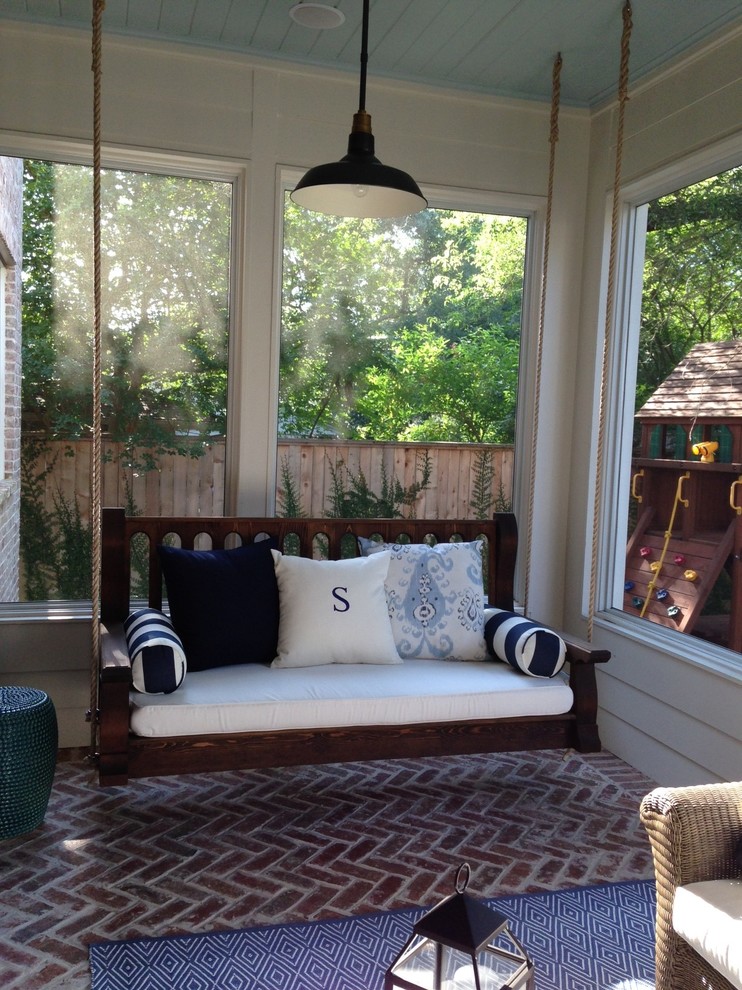 This is an example of a transitional screened-in porch design in Other.