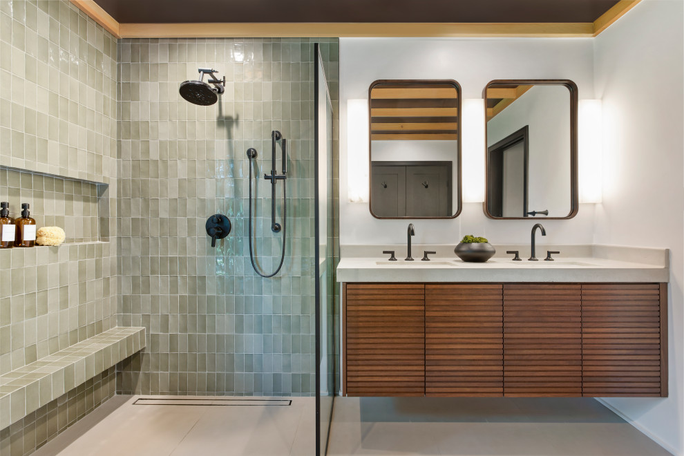 Inspiration for a large contemporary bathroom in Los Angeles with medium wood cabinets, a freestanding tub, a bidet, green tile, porcelain tile, white walls, porcelain floors, an integrated sink, concrete benchtops, grey floor, grey benchtops, a niche, a double vanity, a floating vanity and wood.