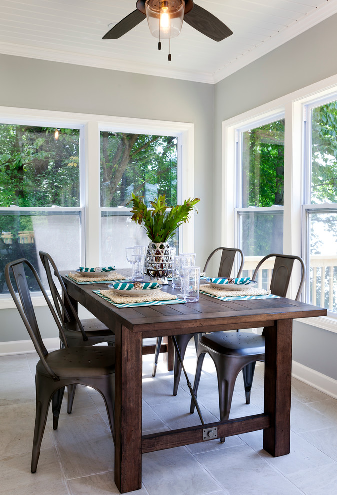 Photo of a beach style dining room in Charlotte with grey walls.
