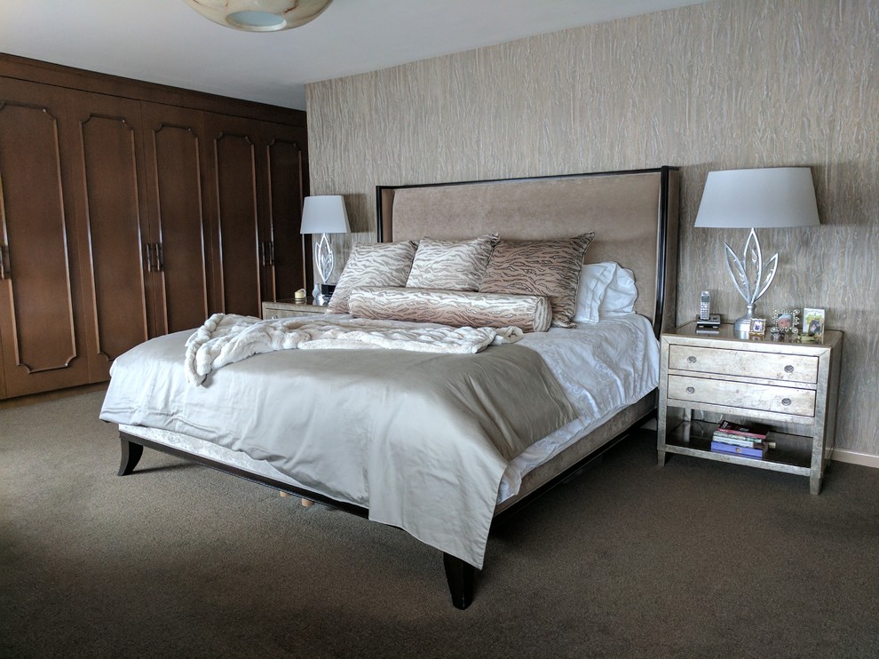Mid-sized contemporary master bedroom in New York with beige walls, carpet, no fireplace and beige floor.