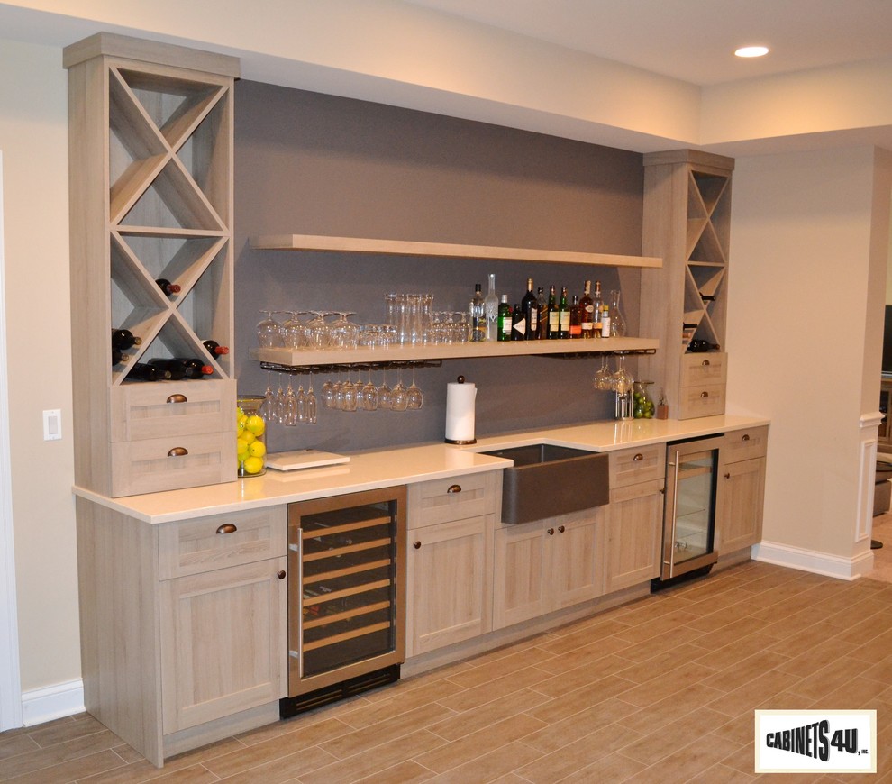 Design ideas for a transitional home bar in Chicago.