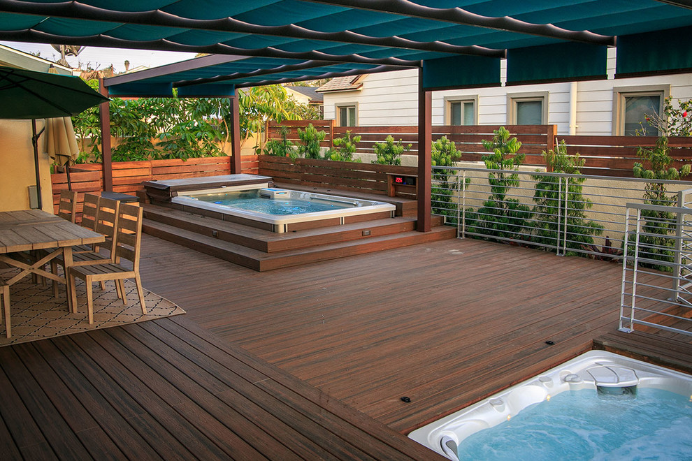 Design ideas for a large modern backyard patio in San Diego with decking and an awning.
