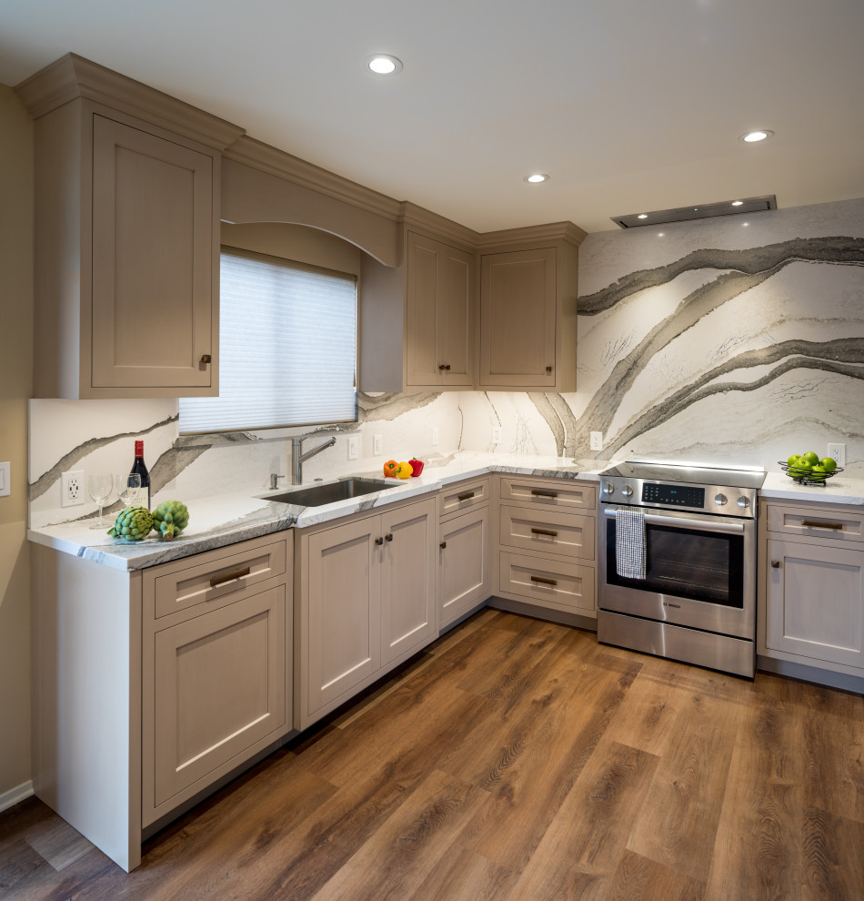 Kitchen pantry - small transitional u-shaped vinyl floor and brown floor kitchen pantry idea in Other with an undermount sink, beige cabinets, quartz countertops, multicolored backsplash, quartz backsplash, stainless steel appliances and multicolored countertops