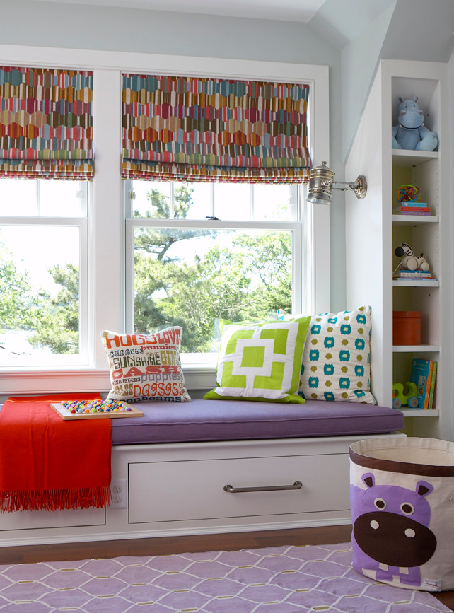 Photo of a beach style kids' bedroom for girls in Boston with carpet and grey walls.